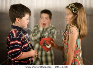சுட்டி டிவி குழந்தைகளுக்காகவா? Stock-photo-little-girl-giving-boy-a-valentine-gets-reaction-from-third-child-24164368