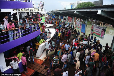 There's actually a train under there... Mass of people try to get on board as millions celebrate the end of Ramadan  Article-2386458-1B304C06000005DC-428_634x422