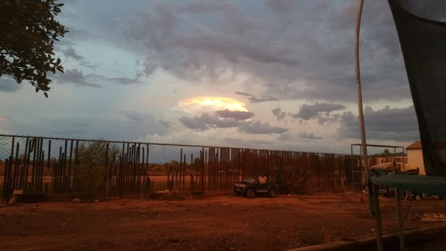 Orange Object in sky behind brilliant white cloud above Phoenix, Arizona  70720_submitter_file1__image