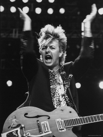 Brian Setzer y más confirmaciones HOY! OOMTD00Z