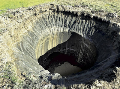 The Opening of the Abyss: Siberia's 'hell mouth' craters opening up 107 years after Tunguska event  260034F000000578-2965385-This_crater_called_B1_was_first_spotted_18_miles_30_km_from_the_-a-27_1424705212373