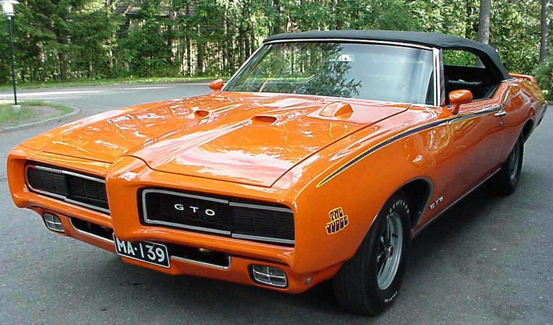 Basé sur l'ordre alphabétique, des noms de voitures, camions, dragsters, vélos, motos, tracteurs, bref tout ce qui roule !... - Page 15 1969_Pontiac_GTO