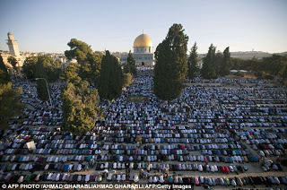 There's actually a train under there... Mass of people try to get on board as millions celebrate the end of Ramadan  Article-2386458-1B32891A000005DC-565_634x421