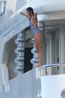 Nina Dobrev with her boyfriend Austin Stowell on a yacht in St Tropez (July 24) NtbajIbo