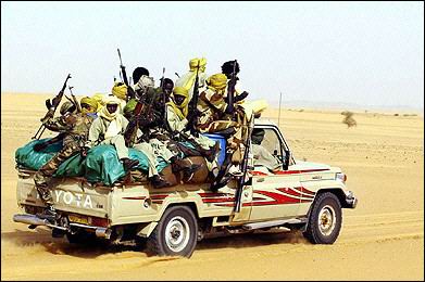 Les vehicules/ tractage/cramage Chadian_soldiers_in_Toyota_pickup_truck_off_to_fight_the_Libyans