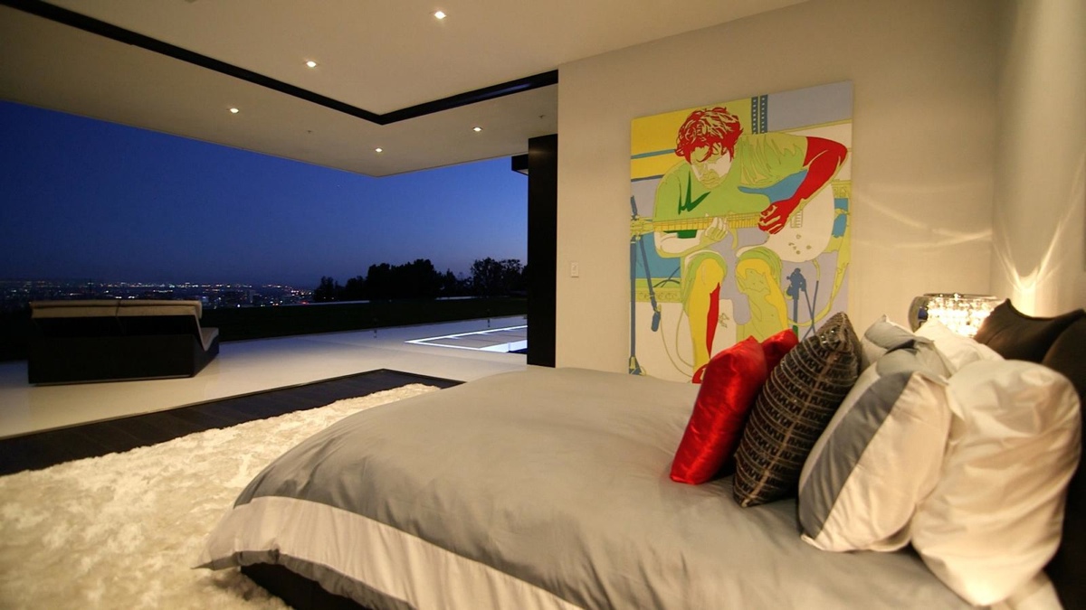 Loftas Man-playing-guitar-art-gray-bedding-overlooking-belair-