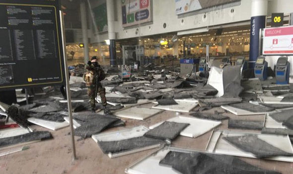 TWO BOMBING ATTACKS AT BRUSSELS AIRPORT - DEAD AND INJURED Glass-windows-at-the-entrance-494693