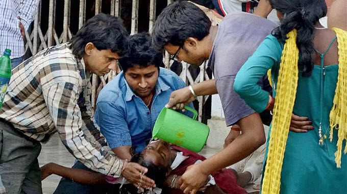 Inspirational Photos of People Helping People in the Wake of Nepal Earthquake Nepal-earthquake-aftermath-men-pouring-water-on-woman-featured