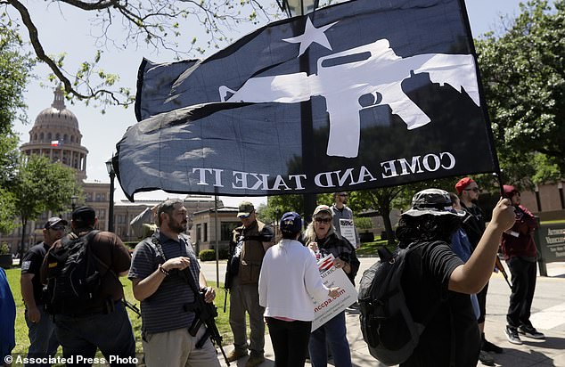 The Serious Side - part 6 - Page 3 2710266-0-A_man_holds_a_Come_and_Take_It_flag_during_a_pro_gun_rights_rall-a-51_1523759816264