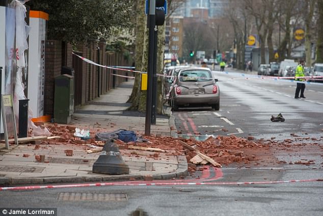 A woman was screaming hysterically and looking to the heavens': Shocked witnesses saw bricks fall five storeys from crane working on £650,000 luxury flats onto woman now fighting for her life 4A9A389800000578-5549165-image-a-92_1522159107151