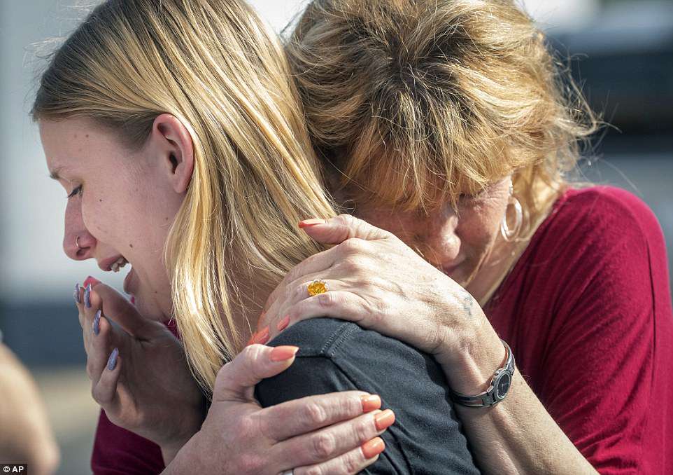 The Serious Side - part 6 - Page 6 4C66DC2A00000578-5745025-Santa_Fe_High_School_student_Dakota_Shrader_is_comforted_by_her_-a-71_1526661656400