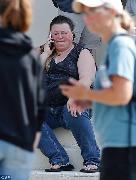 The Serious Side - part 6 - Page 6 4C66EEC800000578-5745025-A_woman_cries_while_talking_on_the_phone_outside_the_Alamo_Gym_w-a-72_1526661656416