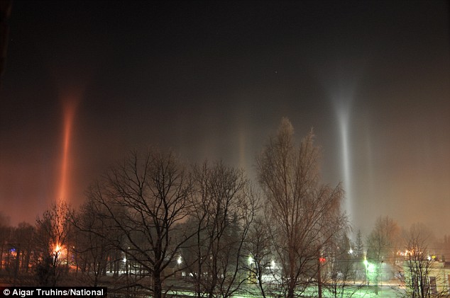 Beam me up: Scientists left baffled as mysterious columns of coloured light appear in the night skies Article-1117264-0310AD7B000005DC-366_634x421