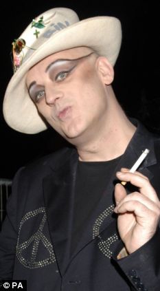 Boy George - 'Drug-crazed idiot' Boy George jailed for 15 months for chaining male escort to wall and beating him Article-1119427-02B348E3000005DC-497_233x423