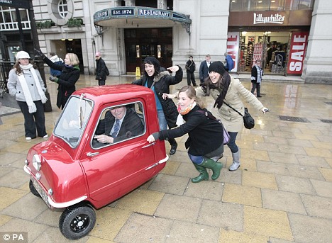 Pictured: The world's smallest car gets out of a tight squeeze Article-1137269-034F4585000005DC-995_468x343