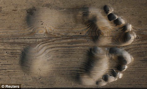 Is it a miracle? Monk who prays so much he has left footprints ingrained in the FLOOR Article-1155980-03ACCF96000005DC-568_468x286