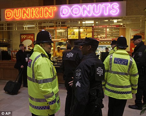 British police fly to Philadelphia to get top tips from U.S. cops. And their first lesson? Where to get the best doughnuts Article-0-03BB7303000005DC-257_468x374