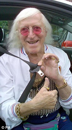 The hands of Jimmy Savile [1926-2011] Article-0-01AF1ABA0000044D-114_233x423