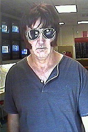 There's a robber down the bookies swears he's Elvis Article-2013518-0CF749BA00000578-85_308x462