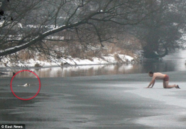 Man risks life to save dog on icy river Article-2100073-11B6D969000005DC-52_634x439