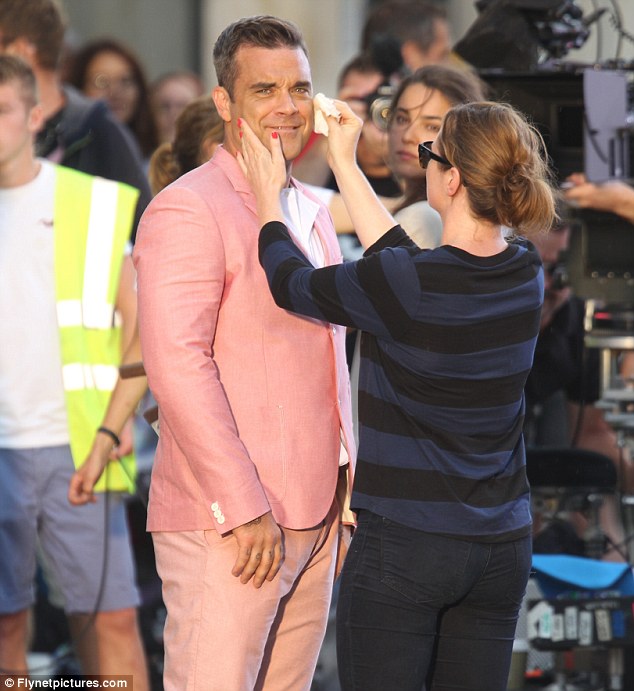 Robbie Williams' body double takes the hit as cars smash into him for the singer's new hard-hitting music video  Article-2189253-14920CFA000005DC-11_634x691