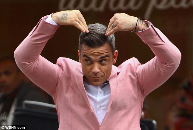 Robbie Williams' body double takes the hit as cars smash into him for the singer's new hard-hitting music video  Article-2189253-1492D6C2000005DC-519_634x429