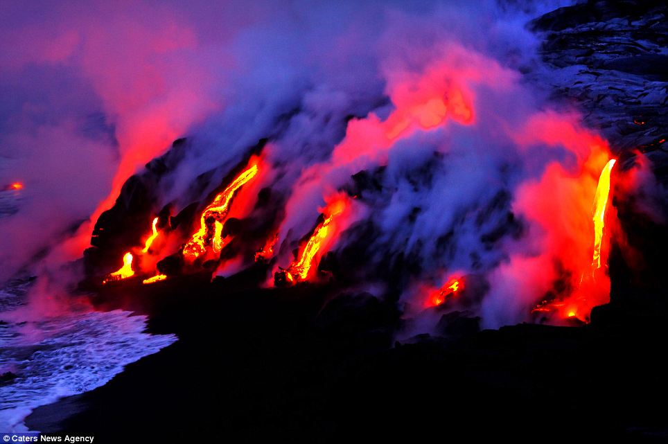 "Photographers brave boiling waters to capture the drama of ... lava crashing into the sea off Hawaii"  Article-2198591-14D87C18000005DC-779_964x641