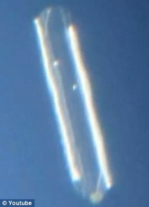 Man photographs hovering cigar-shaped UFO for over two hours as it is witnessed by  Article-2223645-15B33E54000005DC-483_306x423