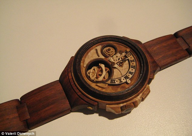 Carpenter carves functioning watches entirely out of wood, even the movement! Article-2329082-19EE8D31000005DC-372_634x450