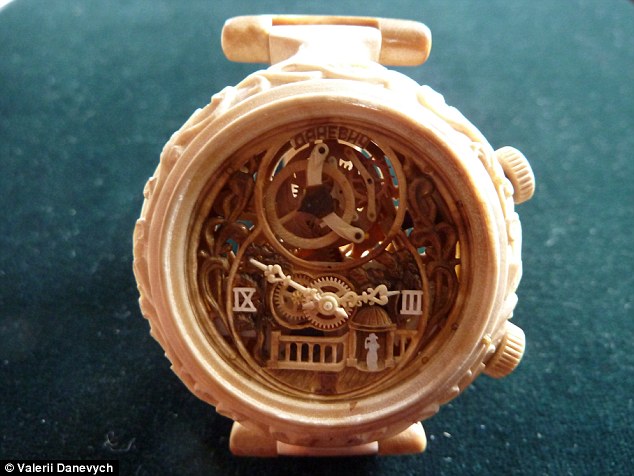 Carpenter carves functioning watches entirely out of wood, even the movement! Article-2329082-19EE8F28000005DC-951_634x476