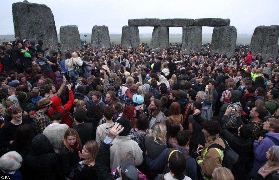 A midsummer day's scene: Revellers rise at dawn to celebrate the solstice with drumming and dancing Article-2345638-1A6F184C000005DC-31_964x624