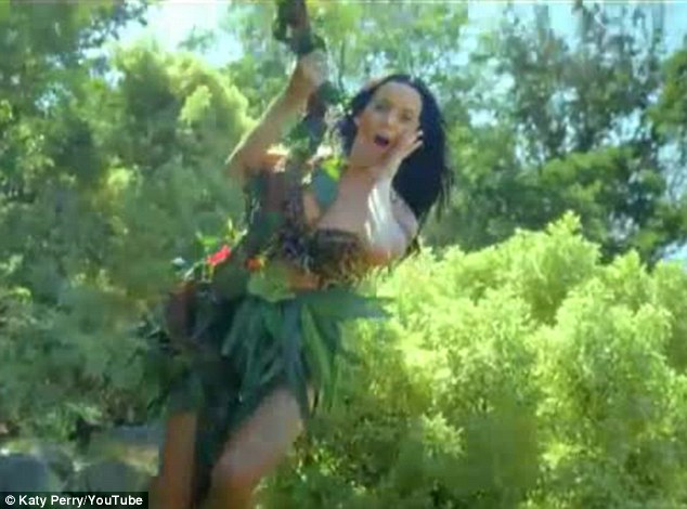 She's a jungle girl! Katy Perry wears leopard print bra as she swings from a vine in new teaser clip for her video for Roar Article-2402063-1B773FF6000005DC-29_634x470