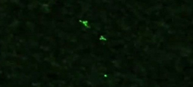 Mystery as haunting night-vision video captures UFOs passing over Germany. Article-2436951-185B572D00000578-590_634x286