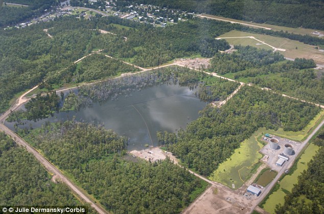 Louisiana sinkhole NOW 24 acres OR 20 Football Fields, HIGH RISK OF EXPLOSION!! Article-2508652-19762F8500000578-625_634x419