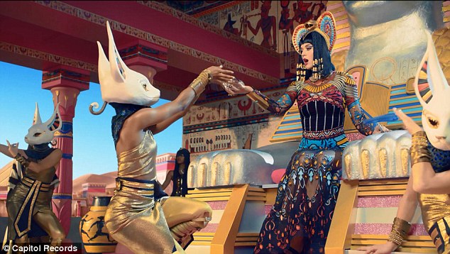 She's a man-eater! Katy Perry straddles a stripper pole as she transforms into evil Egyptian queen for new Dark Horse music video  Article-2564321-1BAFA69B00000578-884_634x358