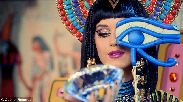 She's a man-eater! Katy Perry straddles a stripper pole as she transforms into evil Egyptian queen for new Dark Horse music video  Article-2564321-1BAFA6AB00000578-221_634x354