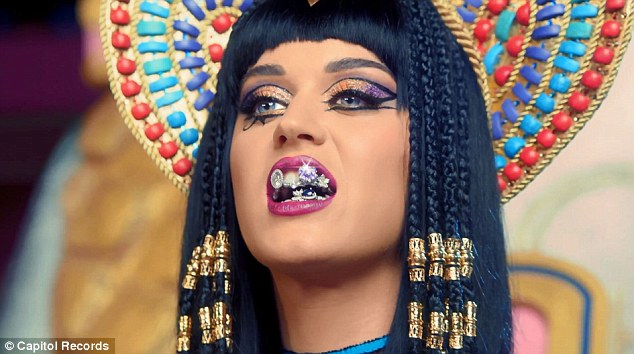 She's a man-eater! Katy Perry straddles a stripper pole as she transforms into evil Egyptian queen for new Dark Horse music video  Article-2564321-1BAFA6E500000578-690_634x354