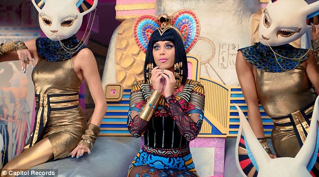 She's a man-eater! Katy Perry straddles a stripper pole as she transforms into evil Egyptian queen for new Dark Horse music video  Article-2564321-1BAFA6FB00000578-838_634x353