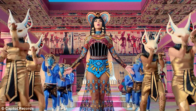 She's a man-eater! Katy Perry straddles a stripper pole as she transforms into evil Egyptian queen for new Dark Horse music video  Article-2564321-1BAFABE200000578-728_634x361