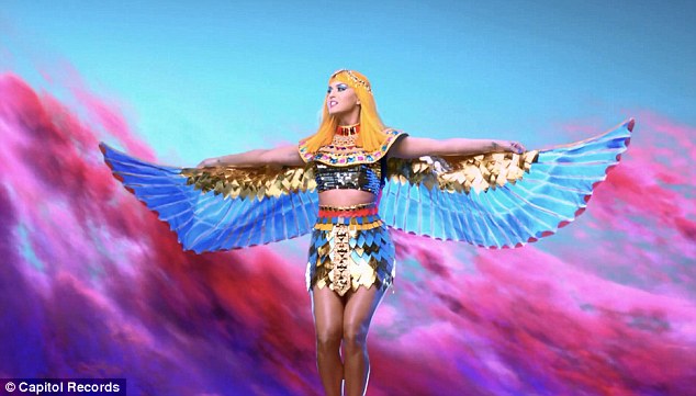 She's a man-eater! Katy Perry straddles a stripper pole as she transforms into evil Egyptian queen for new Dark Horse music video  Article-2564321-1BAFAC2600000578-934_634x361