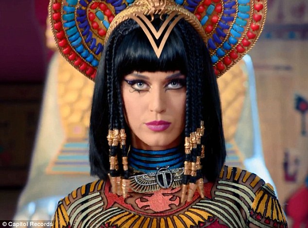 She's a man-eater! Katy Perry straddles a stripper pole as she transforms into evil Egyptian queen for new Dark Horse music video  Article-2564321-1BAFAC3700000578-576_634x469