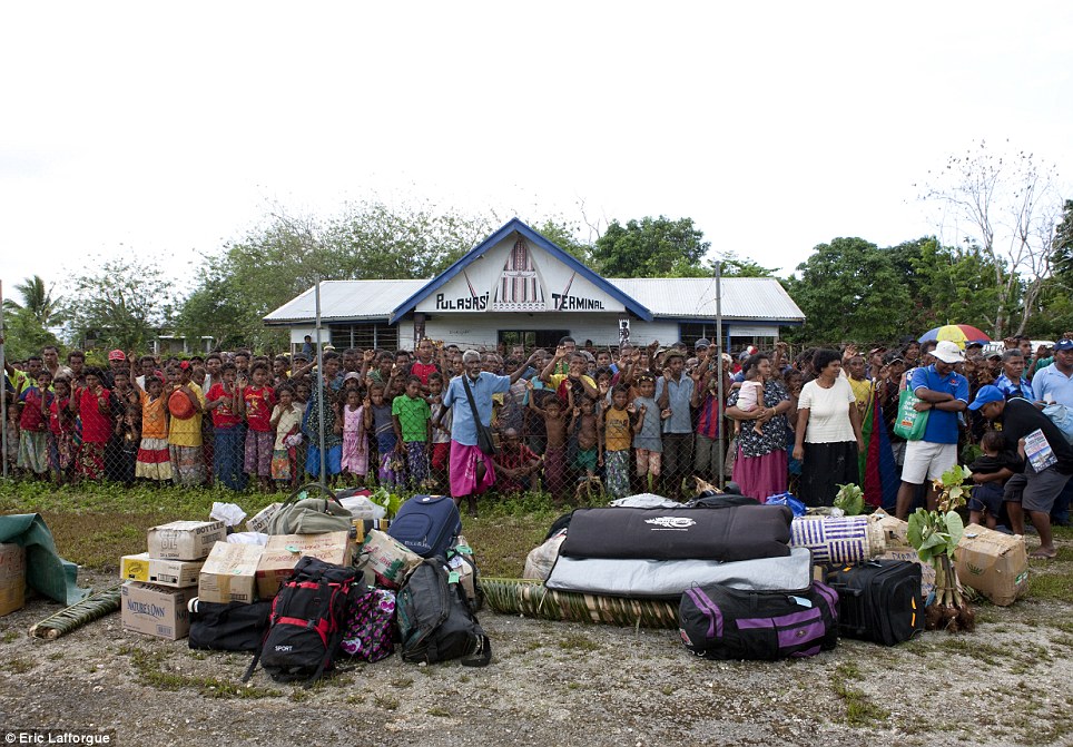 Excitement: The weekly flight from Port Moresby, capital of Papua New Guinea, is the most exciting moment of the week for many and draws huge crowds