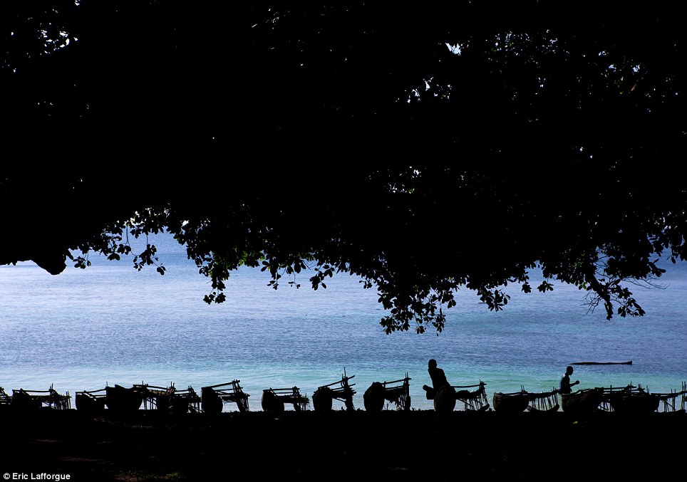 Remote: The idyllic islands are home to the Trobriand Islanders, who still live in much the same way as they always have - including fishing from wooden canoes