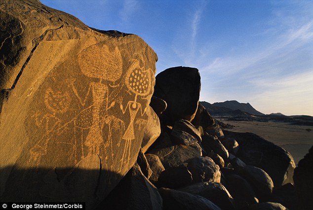 Have aliens already visited Earth? Nasa book suggests that ancient rock art could have been created by extraterrestrials Article-2634903-1E103F1700000578-180_634x426