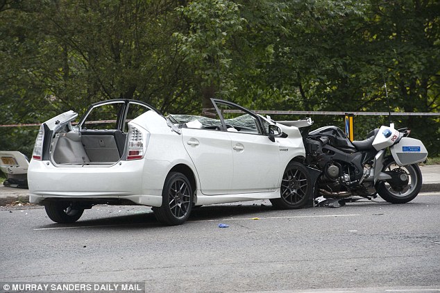 LOL "Prince" Harry's motorbike outrider smashes head-on into taxi 1410468302139_wps_16_THE_POLICE_OUT_RIDERS_MOT