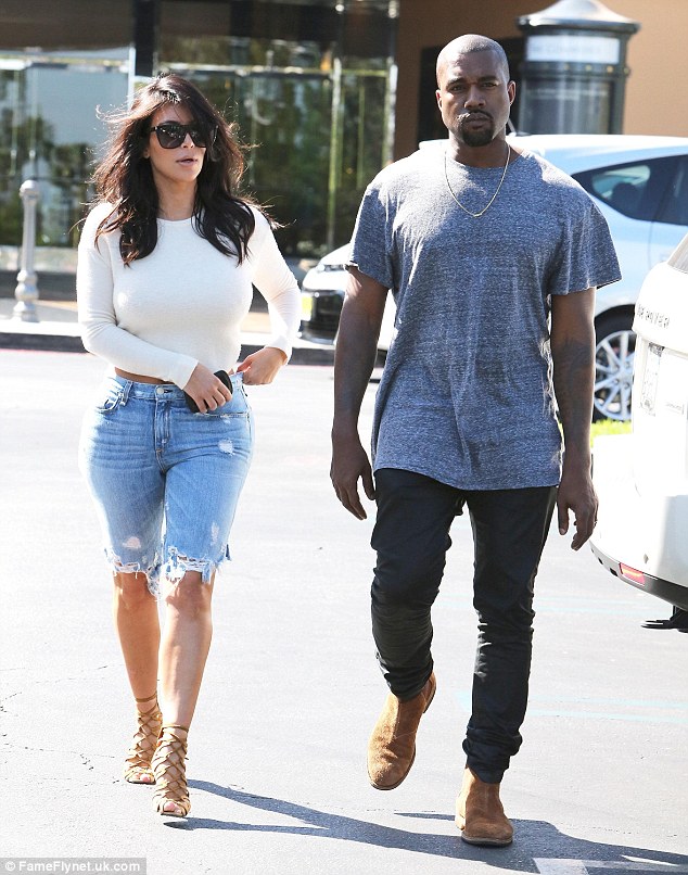 Kim Kardashian dons bizarre ensemble of denim Bermuda shorts, open-back top 1413748398504_wps_3_Picture_Shows_Kim_Kardash