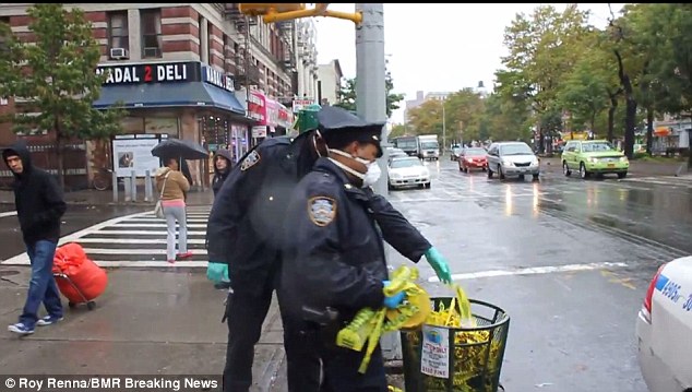 American doctor infected with Ebola - Page 12 1414119276230_wps_58_NYPD_Police_take_down_cau