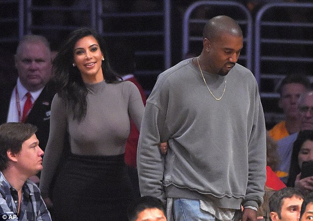 Kim Kardashian and Kanye West enjoy basketball date 1414580817231_Image_galleryImage_Kim_Kardashian_left_and_s