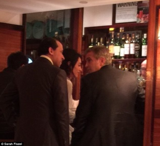 09. April 2015: George Clooney and his wife hold court at Cipriani's bar in Midtown Manhattan 27636A0300000578-3031452-image-m-84_1428551910757