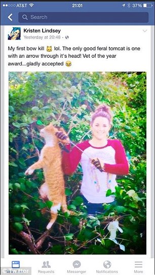 'Vet of the year' fired after posing holding a dead pet cat she killed with a bow and arrow after 'hunting it down in her backyard'   Graphic photo  27AF27FE00000578-0-image-a-2_1429313669480